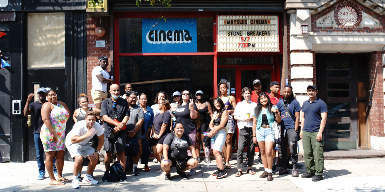 Bard Microcollege for Just Community Leadership students pose outside a cinema.