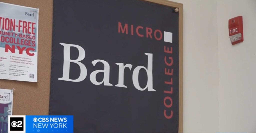 Video still showing the microcollege logo and posters pinned to a bulletin board.